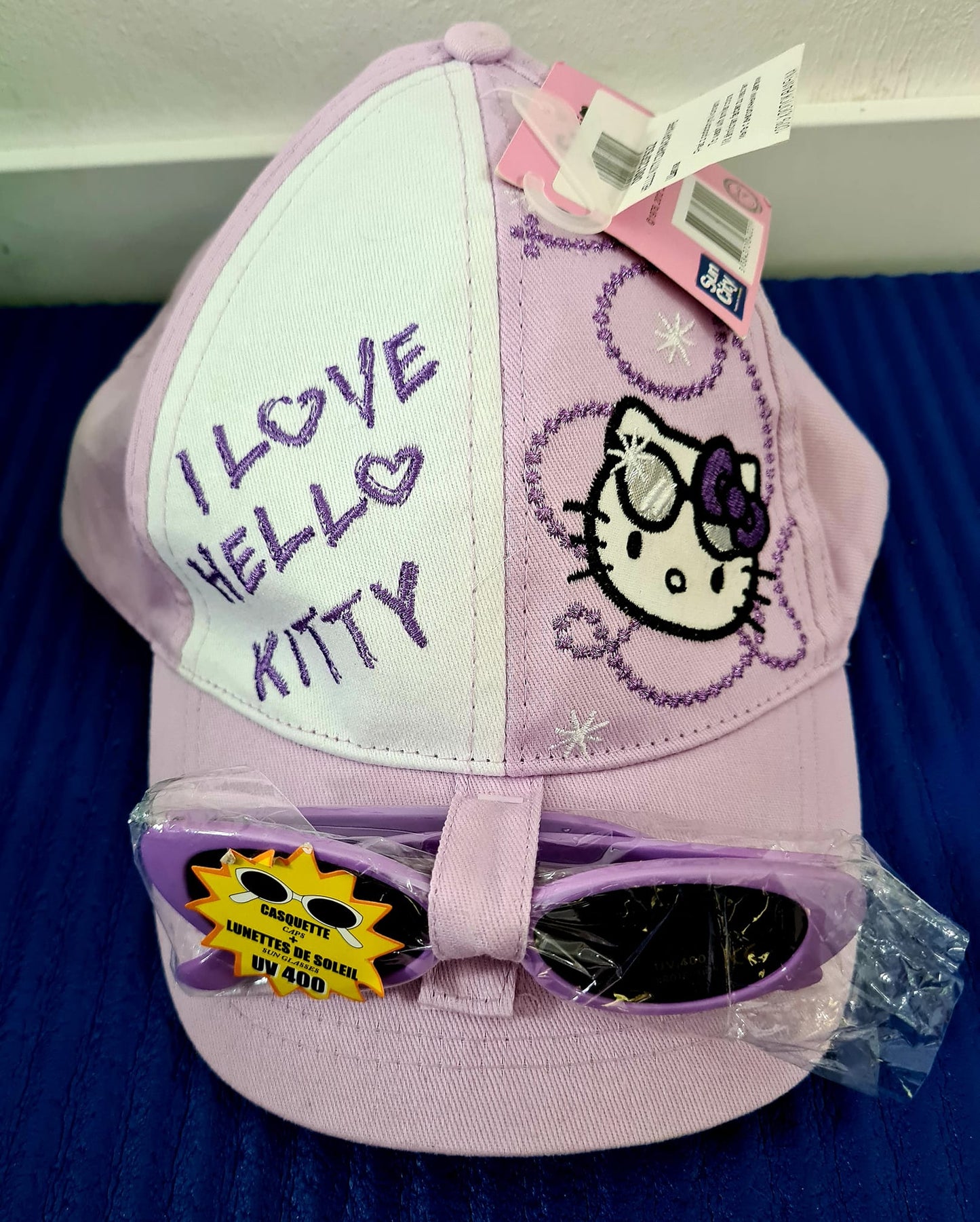 Hello Kitty Capi mit Sonnenbrille in lila - KU 54